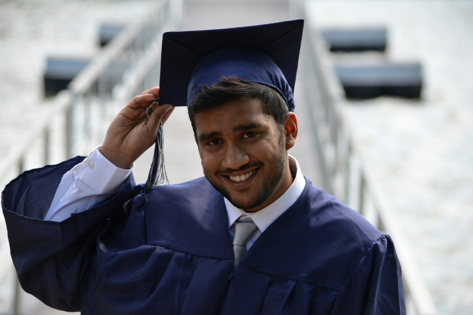Graduates throwing their caps into the air