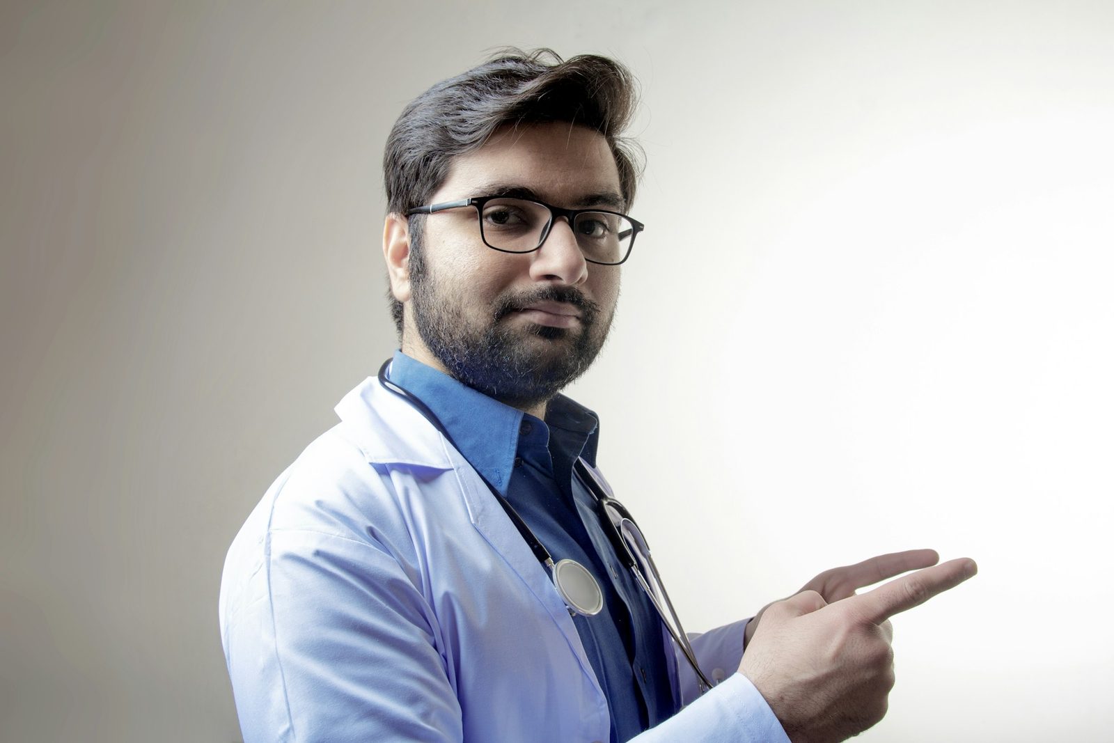 Doctor explaining a report to a patient across a desk