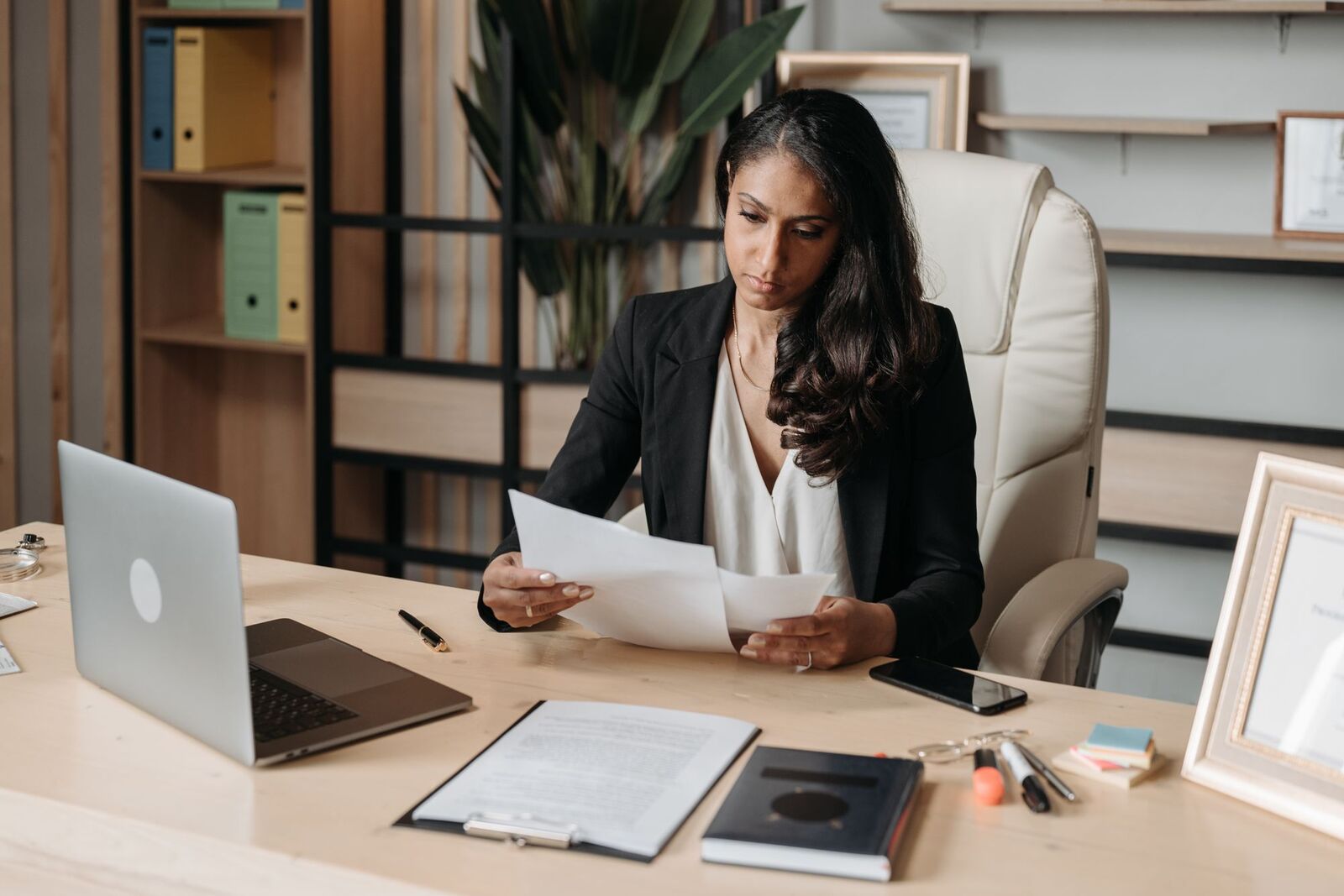 Woman sitting at home with a laptop